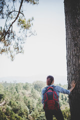 Hiker with backpack on top of a mountain,Freedom and active life concept.