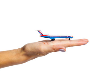 hand holding airplane toy model isolated on white background