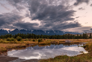 mountains river reflections cloudy evening