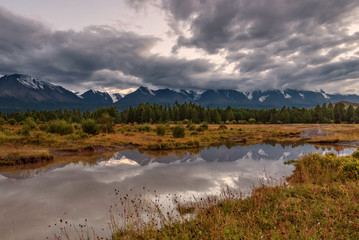 Fototapeta premium mountains river reflections cloudy evening
