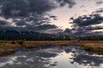 mountains river reflections cloudy evening