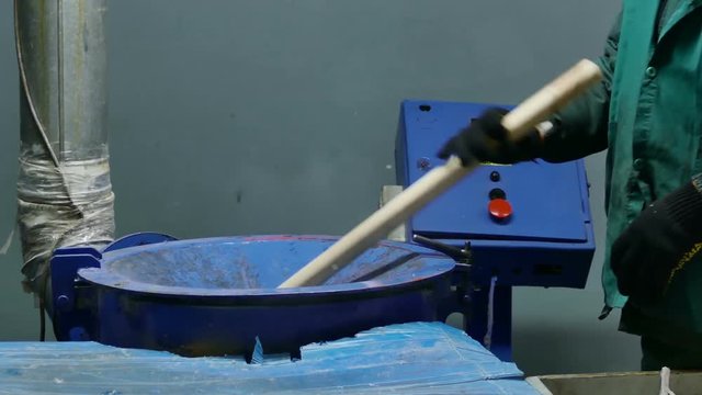 Work lays in the machine used polyethylene. For further processing of garbage processing plant. Close-up