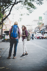 Fototapeta premium Travel couple walking around city on vacation having fun. Couple on holiday.