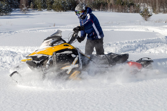 Athlete on a snowmobile
