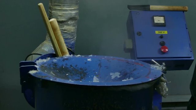 Work lays in the machine used polyethylene. For further processing of garbage processing plant. Close-up