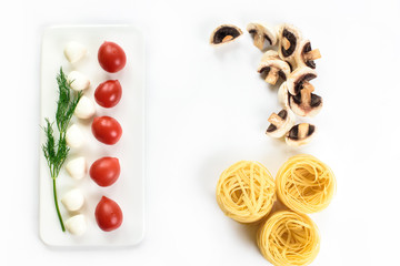 An upper view on a white lay and Italian food ingredients - pasta, tomatoes, greens, mushrooms. Top view with copy space.