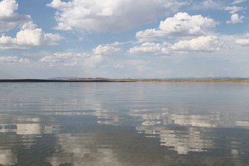the sky reflected in the water, deserted beach lake, summer sky, nature, blue cloud,