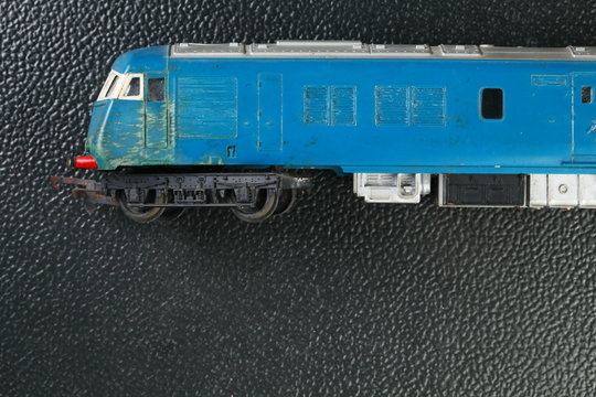 The old and dirty plastic model of train represent the model train concept related idea. - Powered by Adobe