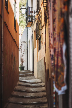 Narrow street with stone stairs