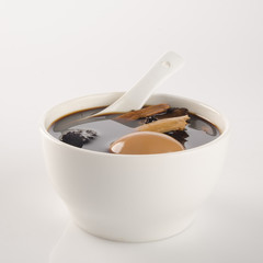 Chinese traditional herbs and medicine soup on background.