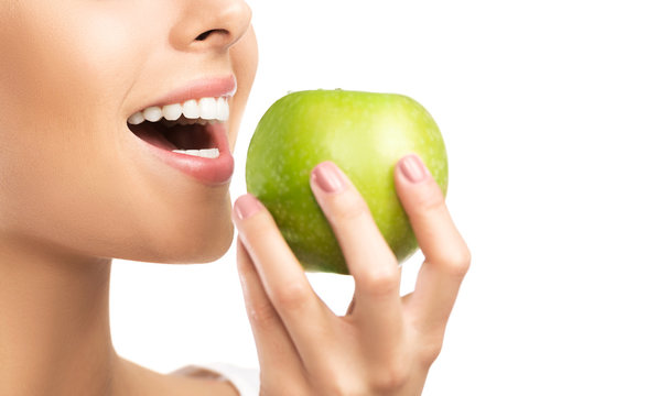 Healthy White Teeth Close Up With An Apple, Isolated On White Background