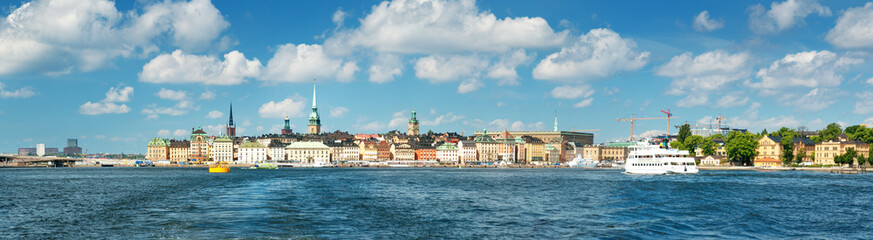 Fototapeta premium View to Stockholm, Sweden with a ferry from sea in summer. Gamla Stan on sunny day
