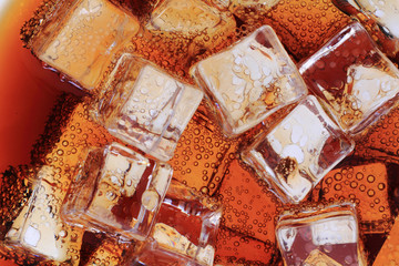 Obraz na płótnie Canvas cola drink with ice cubes texture