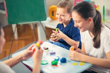 Fototapeta premium Kids Play Modeling Plasticine in the living room