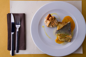 codfish served hot on a plate