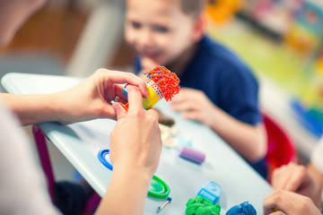 Kids Play Modeling Plasticine in the living room