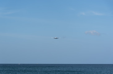 Fototapeta na wymiar airplane landing at Phuket airport