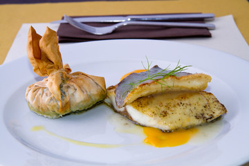 codfish served hot on a plate