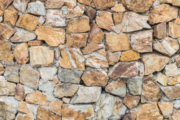 Fototapeta premium Closeup surface brick pattern at old stone brick wall textured background