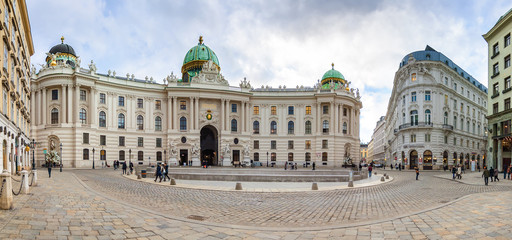 Cloudy panoramic view of Hofburg Palace at Michaelerplatz, Habsburg Empire landmark in Vienna,...