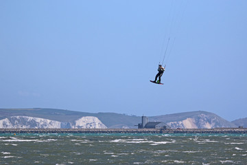 kitesurfer jumping in Portland harbour