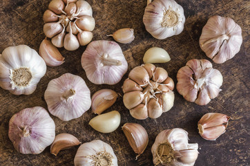 Flatlay top view Garlic Cloves and Garlic Bulb on old table