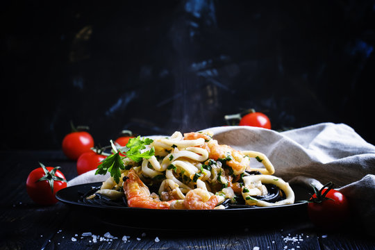 Hot pasta with seafood and tomato sauce, selective focus