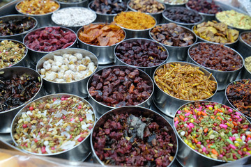 Different spices and herbs in metal bowls on a street market in Kolkata, West Bengal, India 