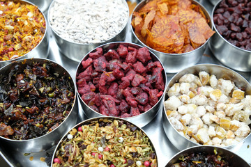 Different spices and herbs in metal bowls on a street market in Kolkata, West Bengal, India 