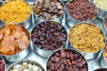 Different spices and herbs in metal bowls on a street market in Kolkata, West Bengal, India 