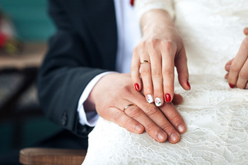 bride hands with wedding rings