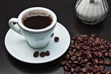 pile of coffee beans and a cup