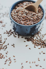 Bowl full of brown flaxseed or linseed. Cereals. Vitamins. Healthy food.