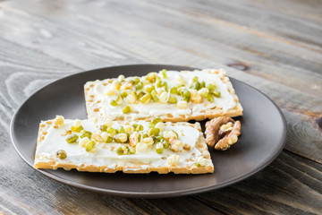 Vegetarian toast smeared with cream cheese, sprouts beans, gluten-free