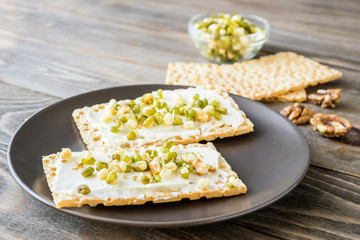 Vegetarian toast smeared with cream cheese, sprouts beans, gluten-free