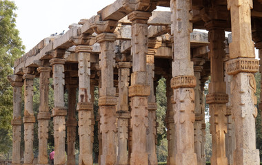 Columns with stone carving in courtyard of Quwwat-Ul-Islam mosque, Qutab Minar complex, Delhi,...