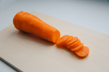 Sliced carrots with waves on a cutting board