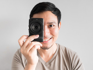 Man taking photo of you with mirrorless camera.