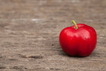 Acerola cherry of thailand on wood. Select focus, Barbados cherry, Malpighia emarginata, high vitamin