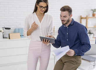 Businesswoman and Businessman Talking