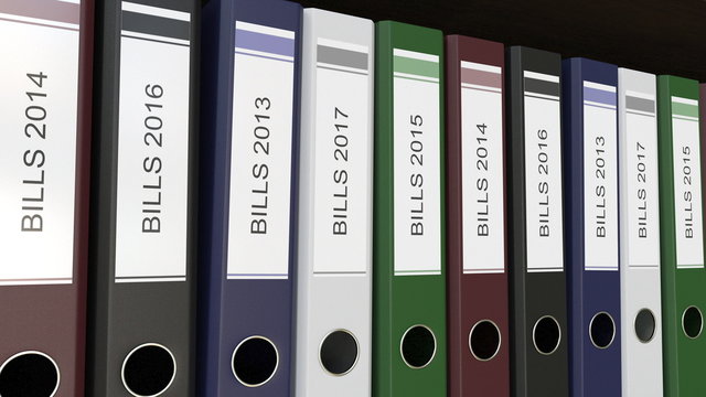 Line of multicolor office binders with Bills tags different years 3D rendering