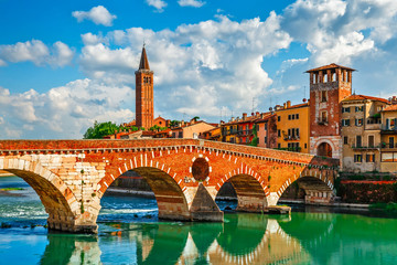 Panoramic view to Bridge Ponte Pietra in Verona on Adige river. - obrazy, fototapety, plakaty