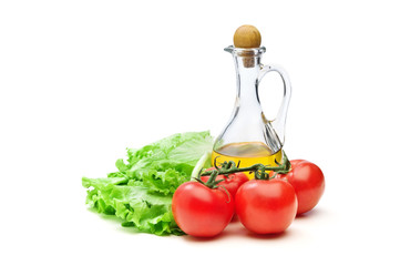 Tomato, lettuce salad and jug of vegetable oil oil isolated
