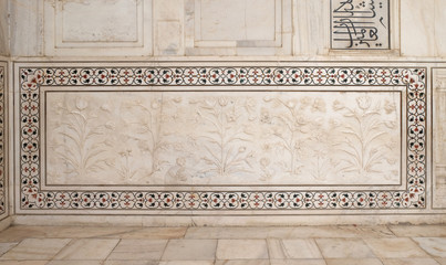 Mughal stone art on the facade of the Taj Mahal (Crown of Palaces), an ivory-white marble mausoleum on the south bank of the Yamuna river in Agra, Uttar Pradesh, India 
