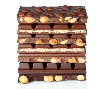 Broken chocolate bars on white background
