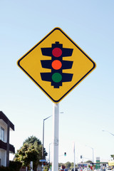 Yellow diamond traffic light sign warning drivers of a light controlled junction