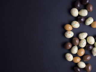 Fototapeta na wymiar Chocolate easter eggs isolated on black background