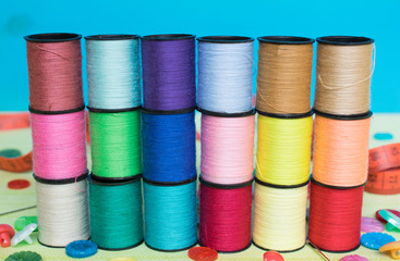 Sewing objects composition on the green textile background