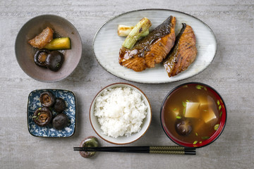 Traditional Japanese dish with Fish Teriyaki and Miso Soup as close-up in bowls