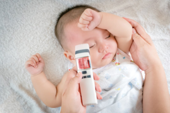 Blurred of image baby sick with thermometer
